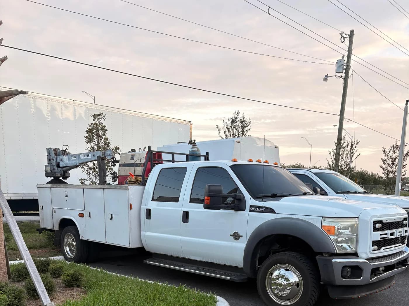 Weld Vision Group service van with the company logo, parked at a Tampa job site
